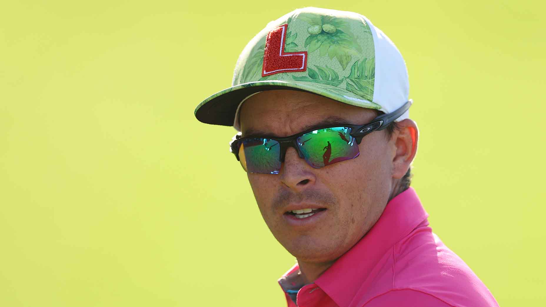 The Story Behind Rickie Fowlers Famous P Hat: Pumas Role in His Golf Style